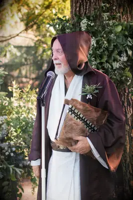 Wedding officiant dressed as Obi-Wan Kenobi from Star Wars