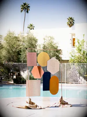 70s themed wedding colorful escort wall