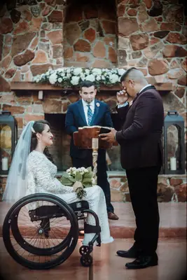 Groom crying while exchanging vows with bride