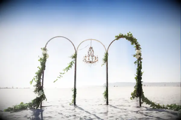 Three wedding arches for a beachside ceremony. 