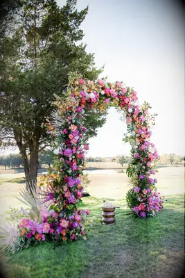 Floral arch covered in hot pink blooms