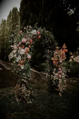 Boho floral arch with dahlias, greenery and lunar