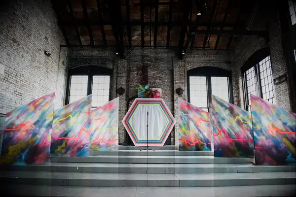 Geometric neon dyed wedding arch