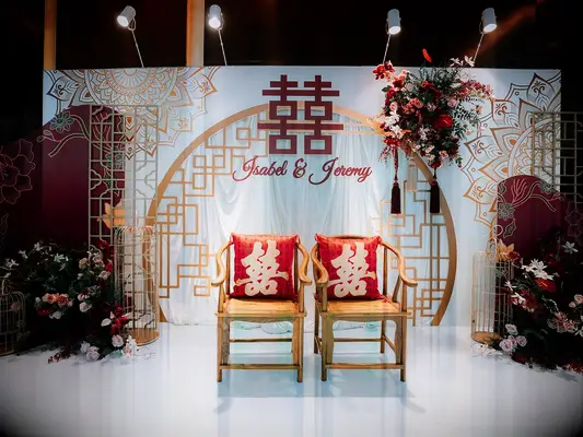 Multicultural gold and red wedding archway