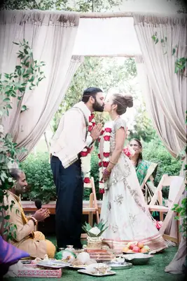 Couples first kiss prayer hands pose