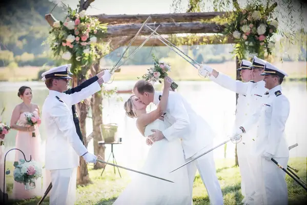 Couples first military salute wedding kiss