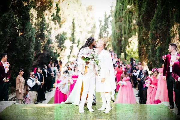Couples simple standing first wedding kiss pose