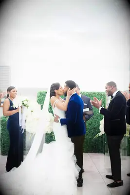 Couples first pulled in wedding kiss pose