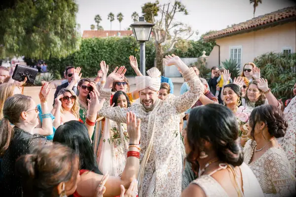 A couple celebrating a Baraat on their wedding day