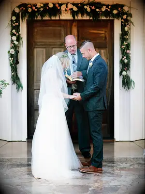 Wedding day photo moment, praying together at the ceremony