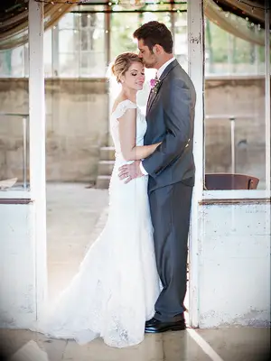 A couple pose idea with soft backlighting for wedding day photos