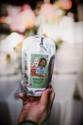 Juice pouch wedding mocktail with portrait of bride and groom