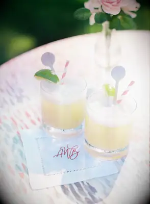 Pineapple mocktail with embroidered napkin at wedding 