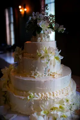 Tiered frosted cheesecake wedding cake