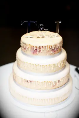 Four-tier cheesecake with initial toppers