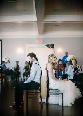 Couple playing wedding shoe game