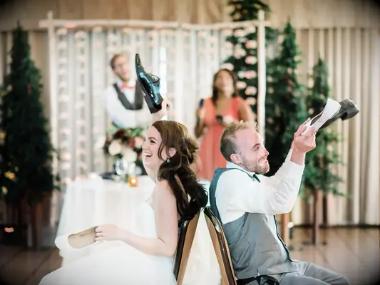 Couple playing wedding shoe game