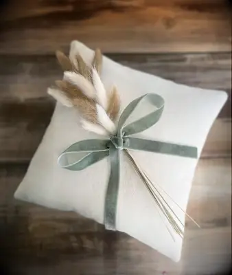 White velvet ring bearer pillow with sage green velvet ribbon