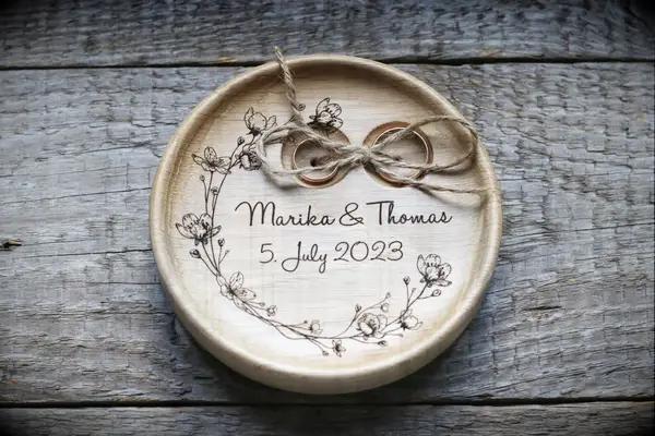Personalized wood ring bearer pillow with engraved floral detail