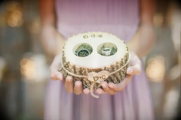 Wood slice ring bearer pillow with carved initials and wedding date detail