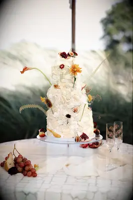 Fruit decorated tiered wedding cake