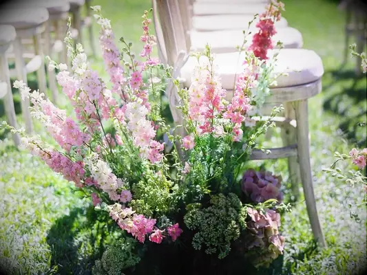pink delphinium aisle arrangement