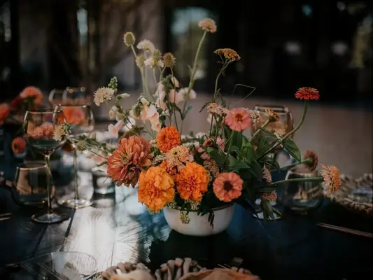 orange zinnia wedding centerpiece