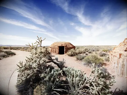 desert landscape with native american hogan structure