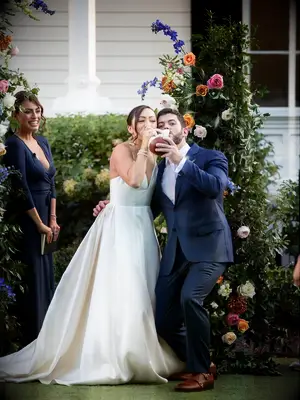 couples drinking from vase during Native American wedding ceremony