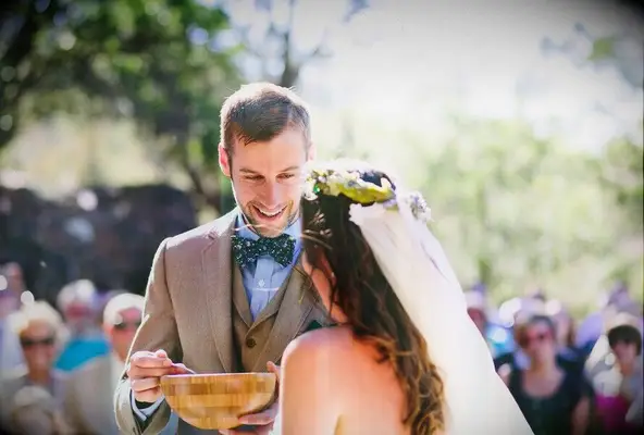 groom eating from bowl of cornmeal at Native American Wedding