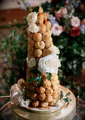 Croquembouche wedding cake with white roses