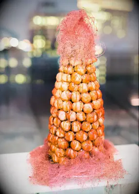 Coral crouquembouche wedding cake