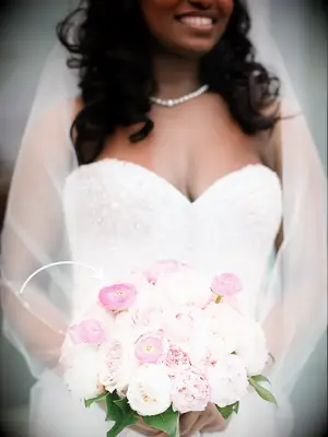 Pink bouquet made of peonies, garden roses and ranunculus 