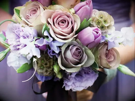 Purple and white bridal bouquet with sweet peas, hydrangea and lavender