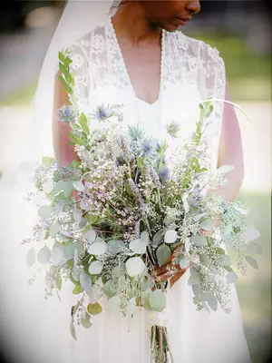Rustic bridal bouquet with eucalyptus, lavender and thistles