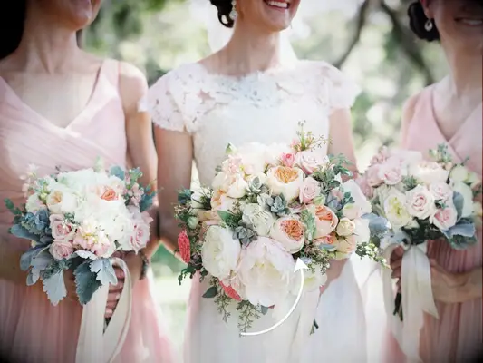 Pastel bridesmaid bouquets with garden rose accents