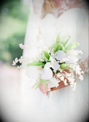 Light blush bridal bouquet with roses and lily of the valley