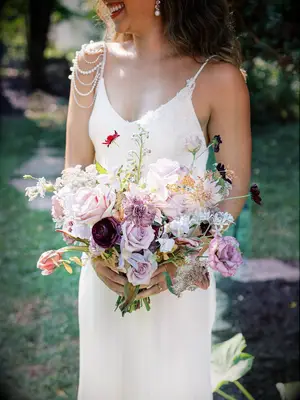 Purple whimsical bouquet garden wedding idea