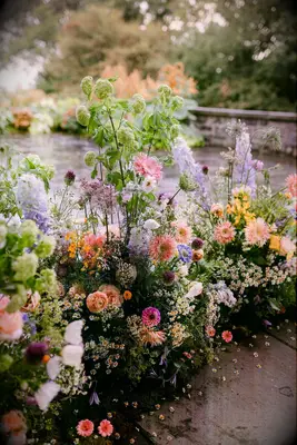 Spring aisle floral installation garden wedding idea