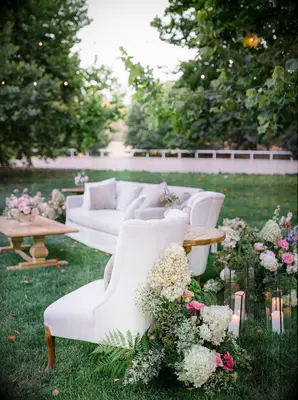 Flower-filled lounge area garden wedding idea
