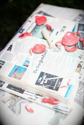 Newspaper and crab-shaped groom