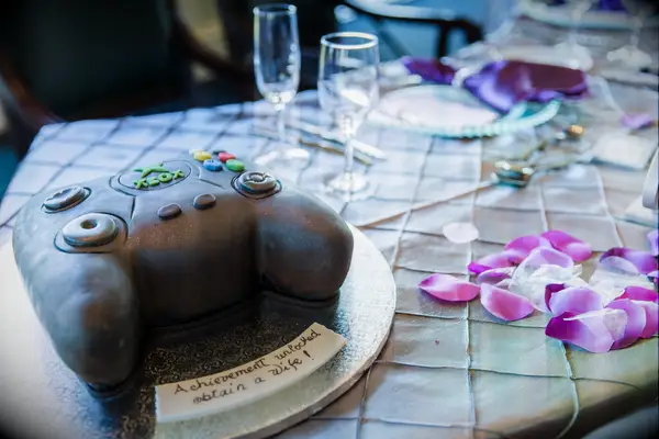 Black Xbox controller-shaped groom