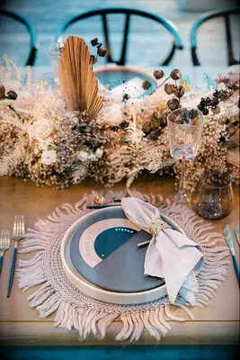 Neutral place setting at boho wedding