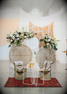 Boho sweetheart chairs at wedding