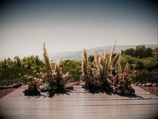 Pampas grass altar decor at boho wedding