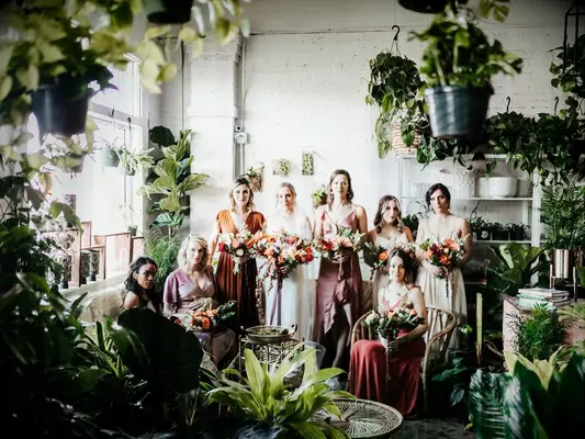 Bride and bridesmaids at a boho wedding with a vibrant color palette
