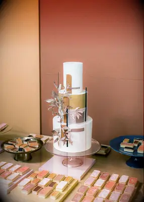 Modern earth tone wedding cake at boho wedding