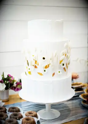 Dried floral wedding cake at boho wedding