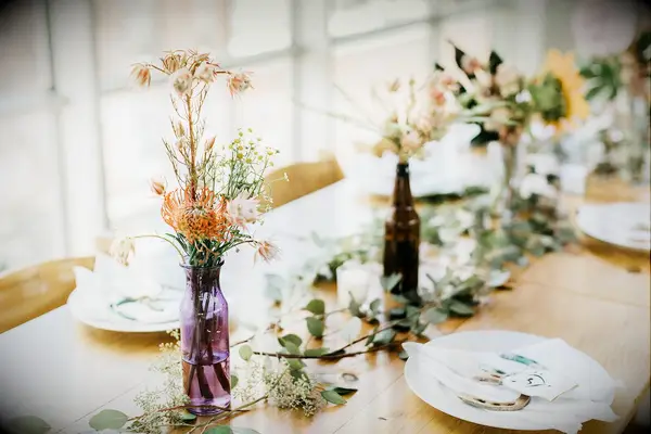 Bottle centerpieces at boho wedding