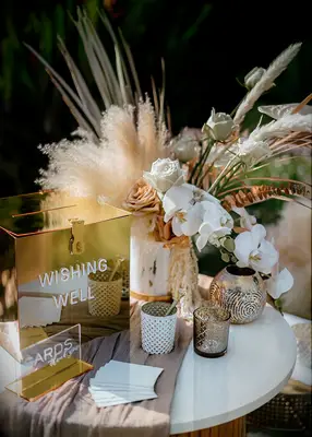 Gold card table at boho wedding